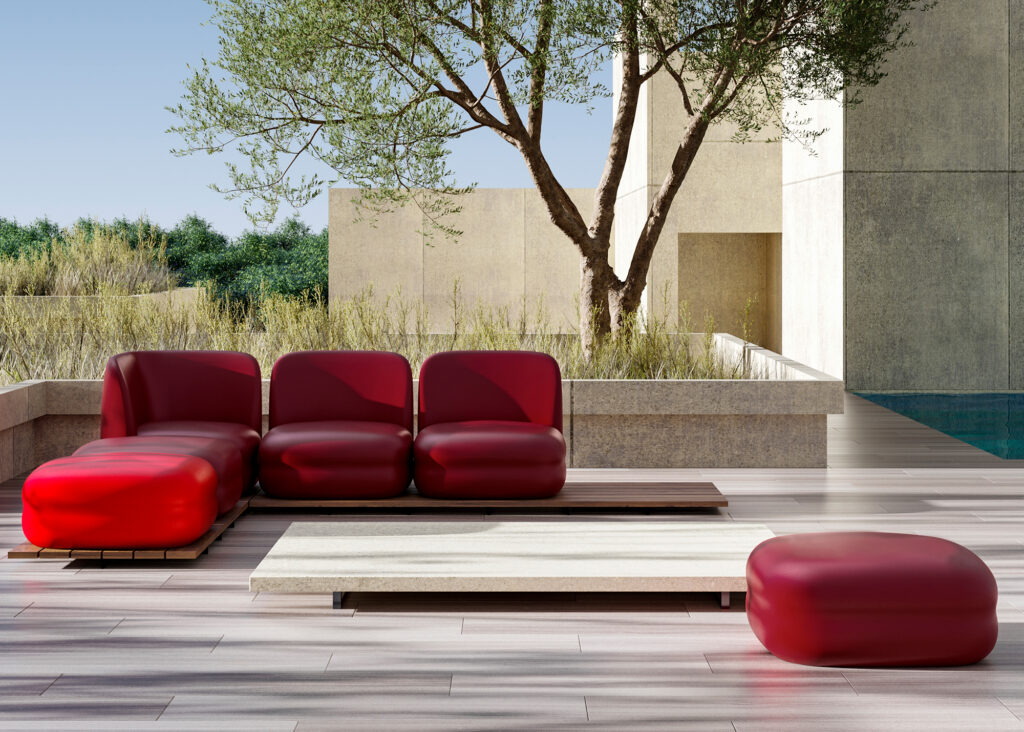 Bõln outdoor seating and ottomans in shades of red on sunny deck
