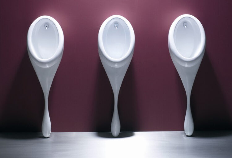 Spoon urinals on wall