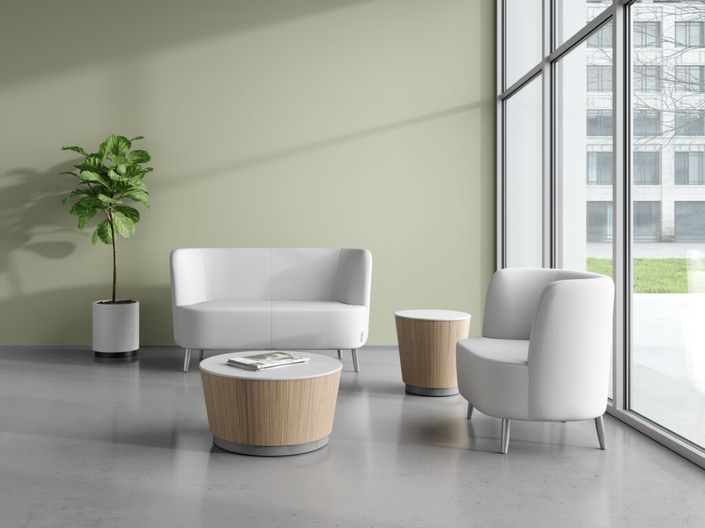 Two drum-style tables with medium brown finish and white tops with white loveseats