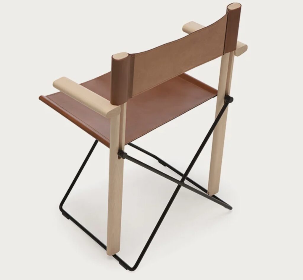 rear view of an elegant folding chair with steel base, beech wood arms and frame, and leather seat and back