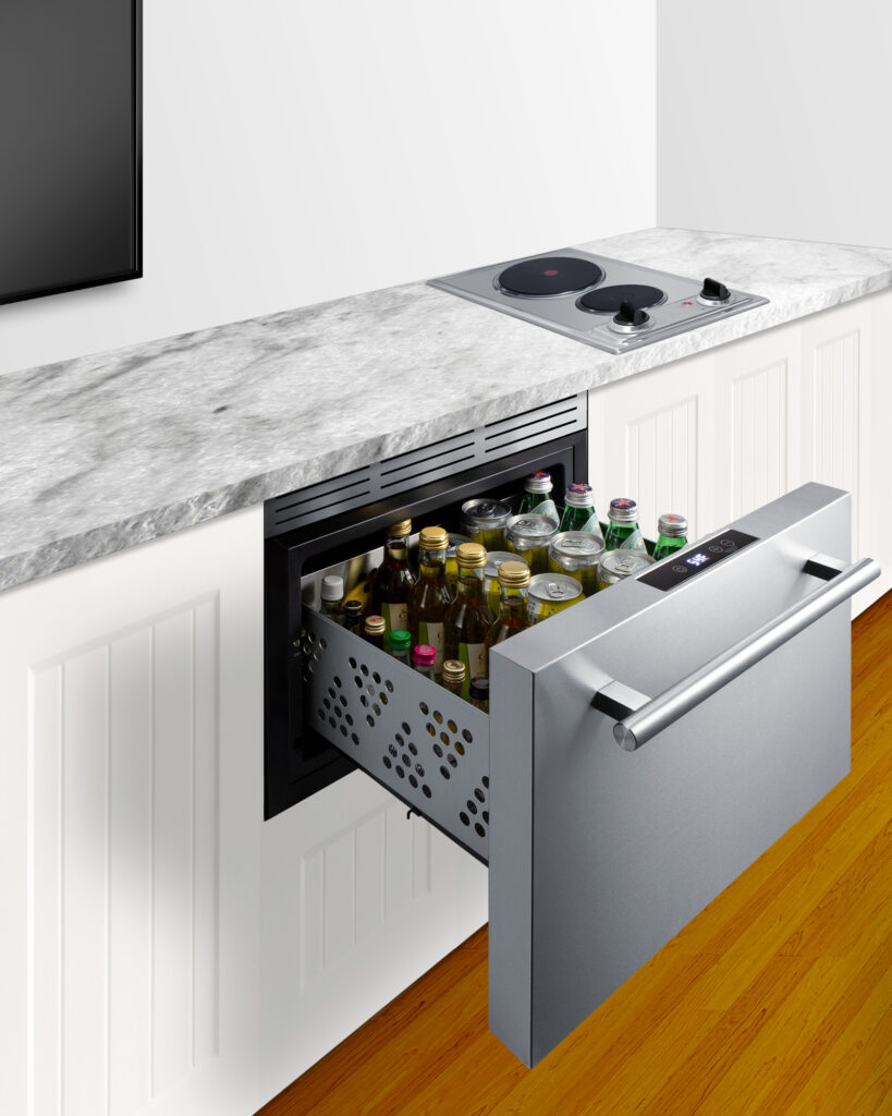 mini-fridge built into kitchen countertop with range