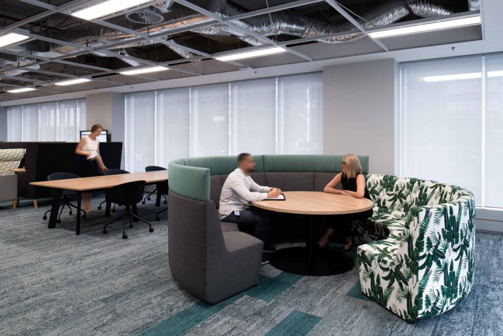 Modular lounge in dark gray, green, and fabric with biophilic print