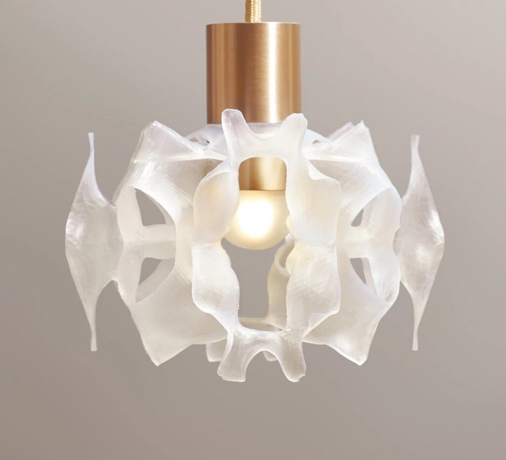 Launch Pad light with Georgia O'Keefe-like shape for translucent diffuser and gold shaft