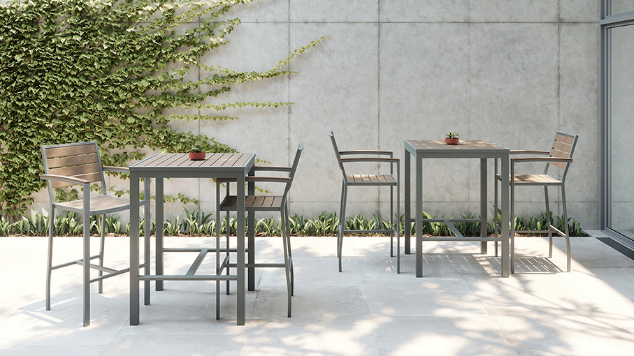 High tables with high chairs on concrete patio