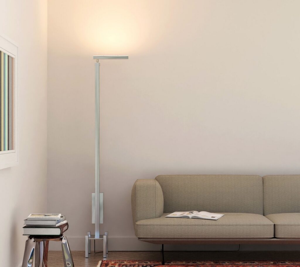 Launch Pad illuminator light by Layzers next to sofa and small table