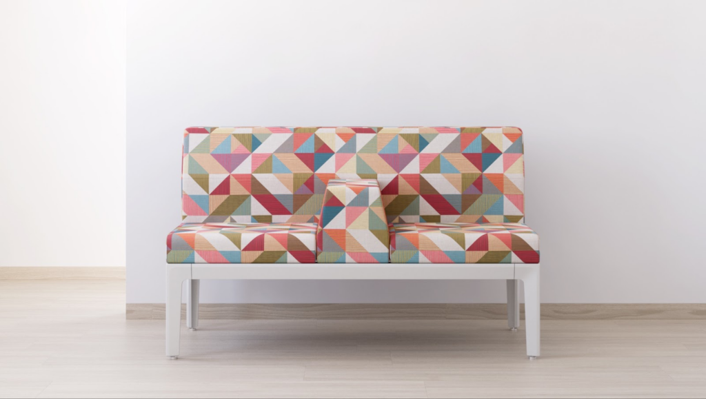 Tangram Textile bright colors in geometric shapes on loveseat