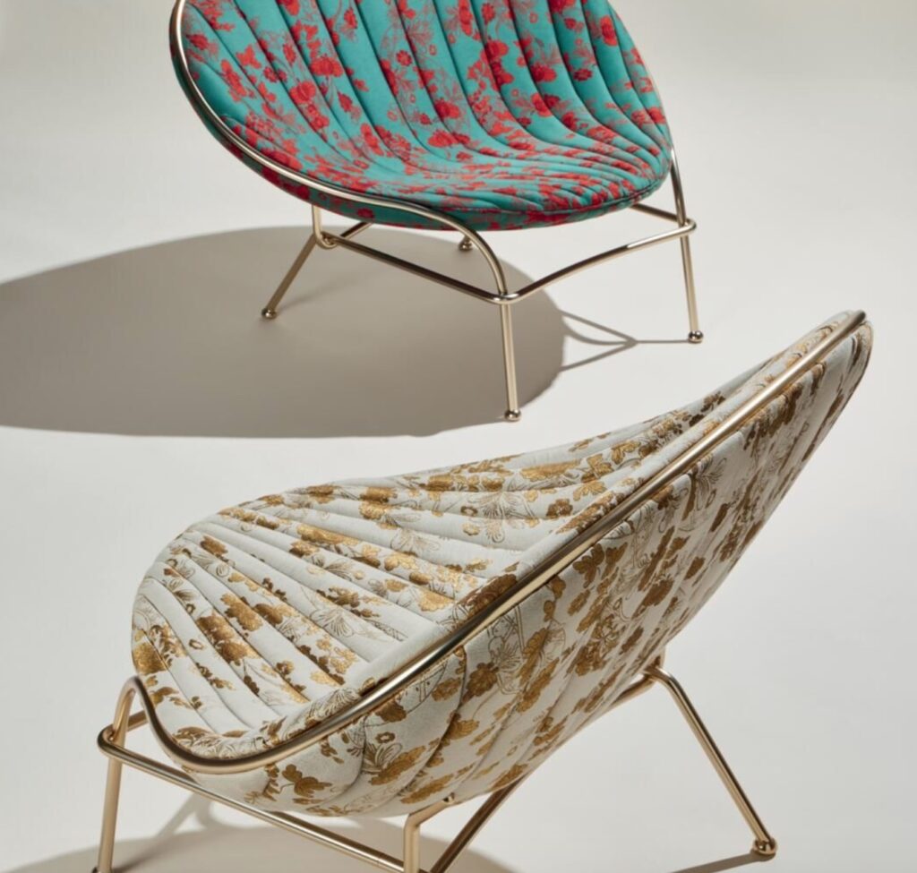 LaVenus chair: two chairs from above one in aqua/red the other in white/gold with foliage pattern on upholstery