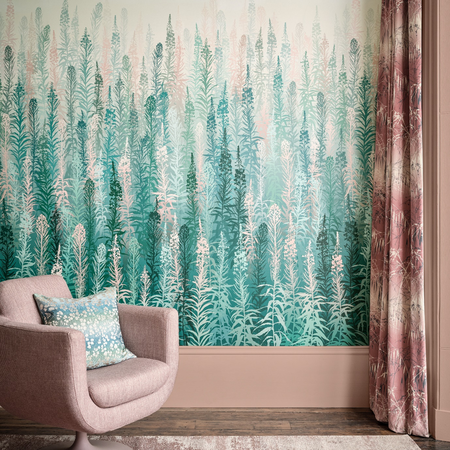 Botanical wallpaper design with fern-like shapes in green, pale pink, white with salmon-colored chair