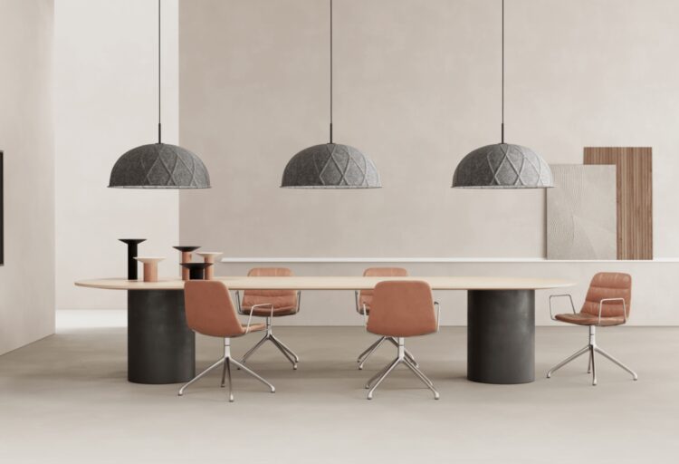 Georgina pendant: three pendants in gray above long stadium-style table with five task chairs