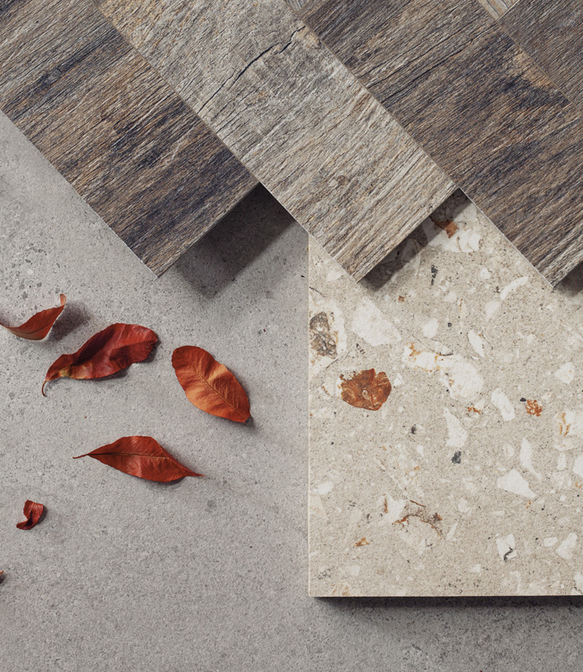Logico mood board with wood-like surface, terrazzo, and autumn leaves