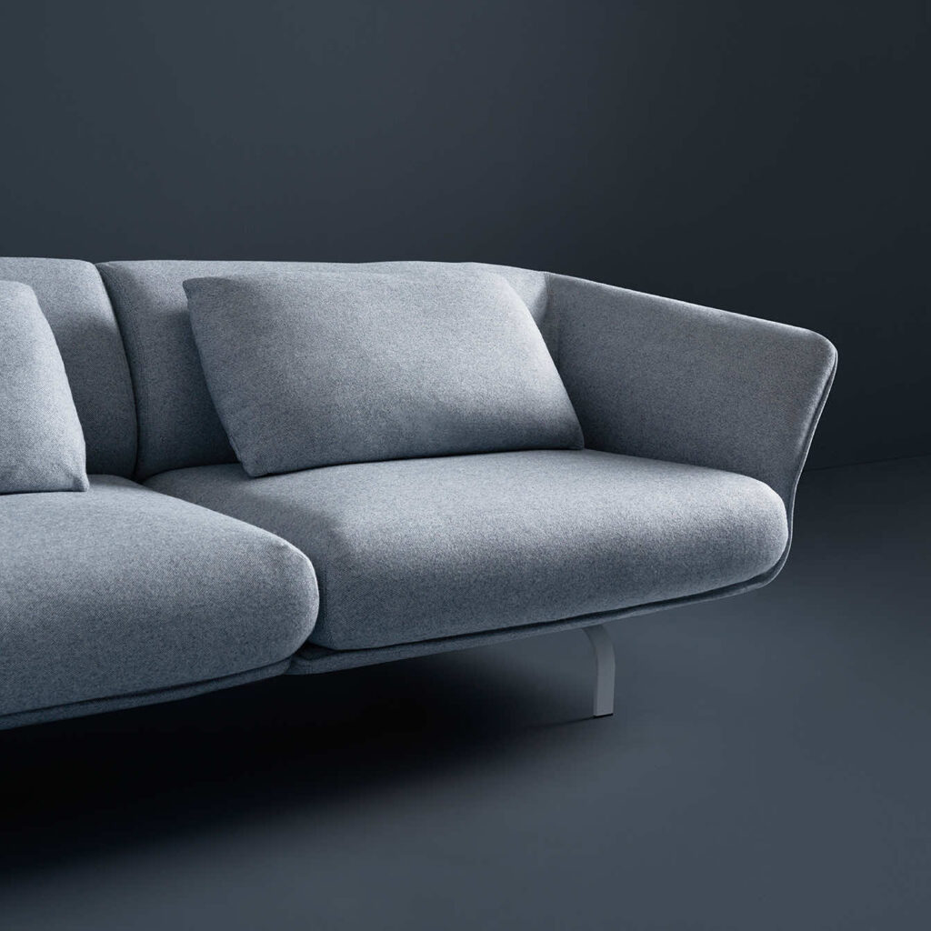 Partial view, gray sofa with pillows