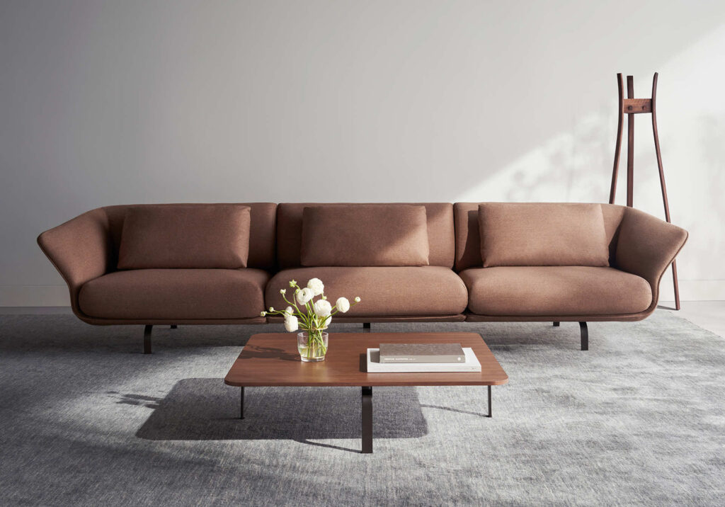Sofa in brown with table on rug
