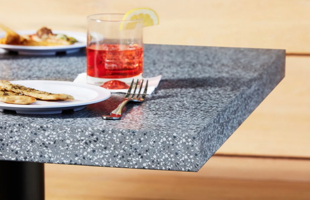 café table in Everform solid surface, gray with speckled white and black