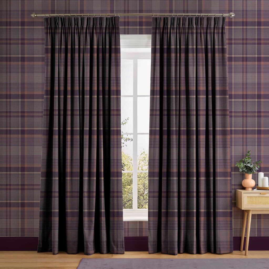 Plaid fabric in shades of purple on curtains and wallpaper