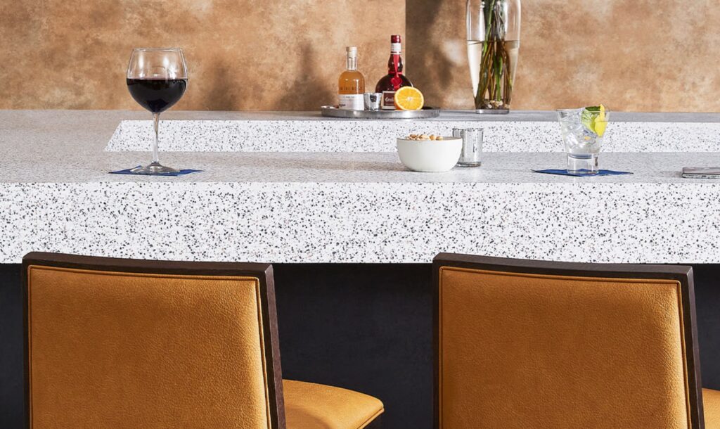 kitchen island with Everform solid surface, terrazzo white and blue