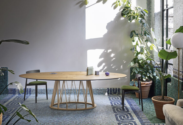 ACCO table in wood in airy dining room