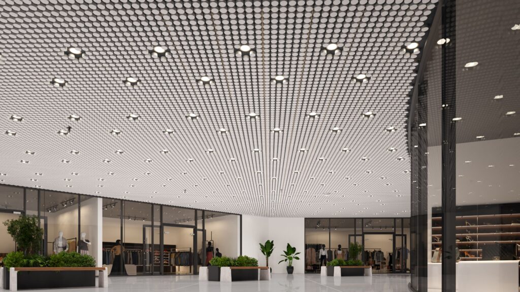 Large ceiling installation of white acoustical panels in mall outside department store