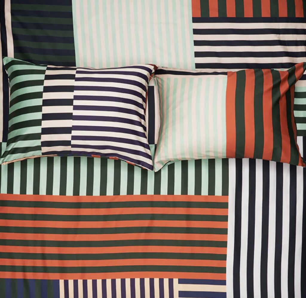 Aligned Three bedding with verical and horizontal stripes in different colors