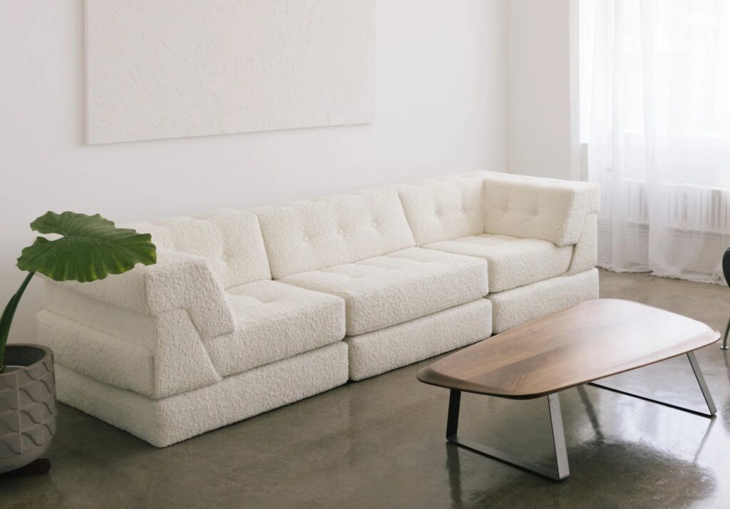 White modular sofa with fuzzy upholstery