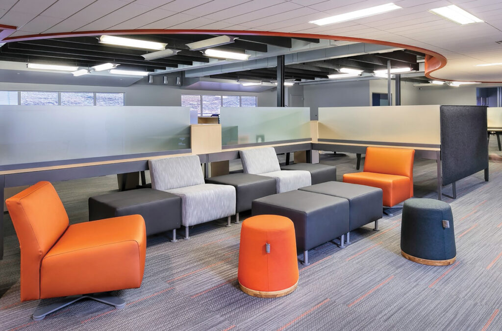 orange and blue poufs in colorful office space