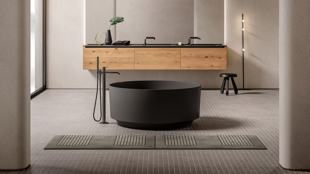 Large gray circular tub with oak paneled vanity