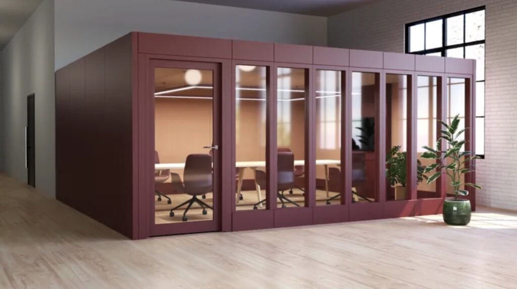 Long meeting room with maroon exterior and large conference table