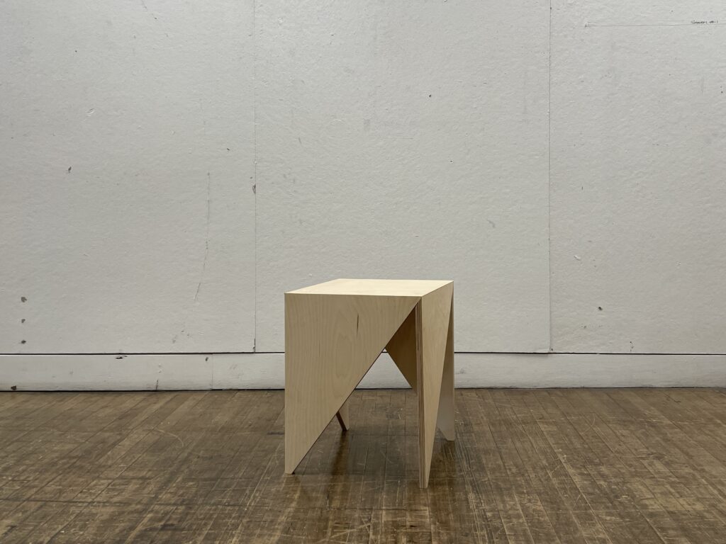 Plywood table on wood floor