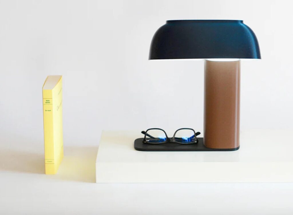 mrlt. lamp in blue with glasses and book nearby