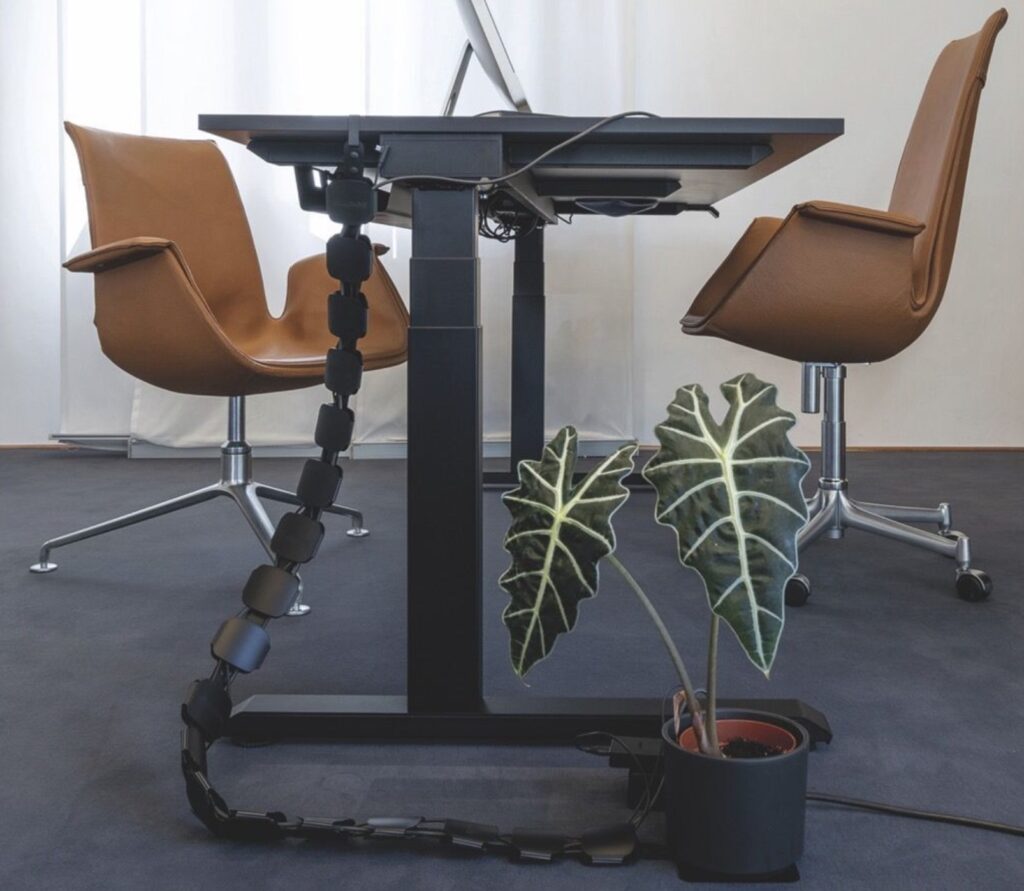 Cable Hug in black with sit-stand desk