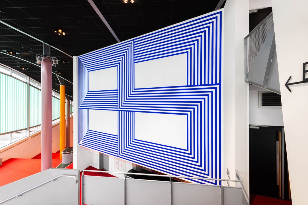 Jan van der Ploeg painted wall with blue lines intersecting in a rectangular form