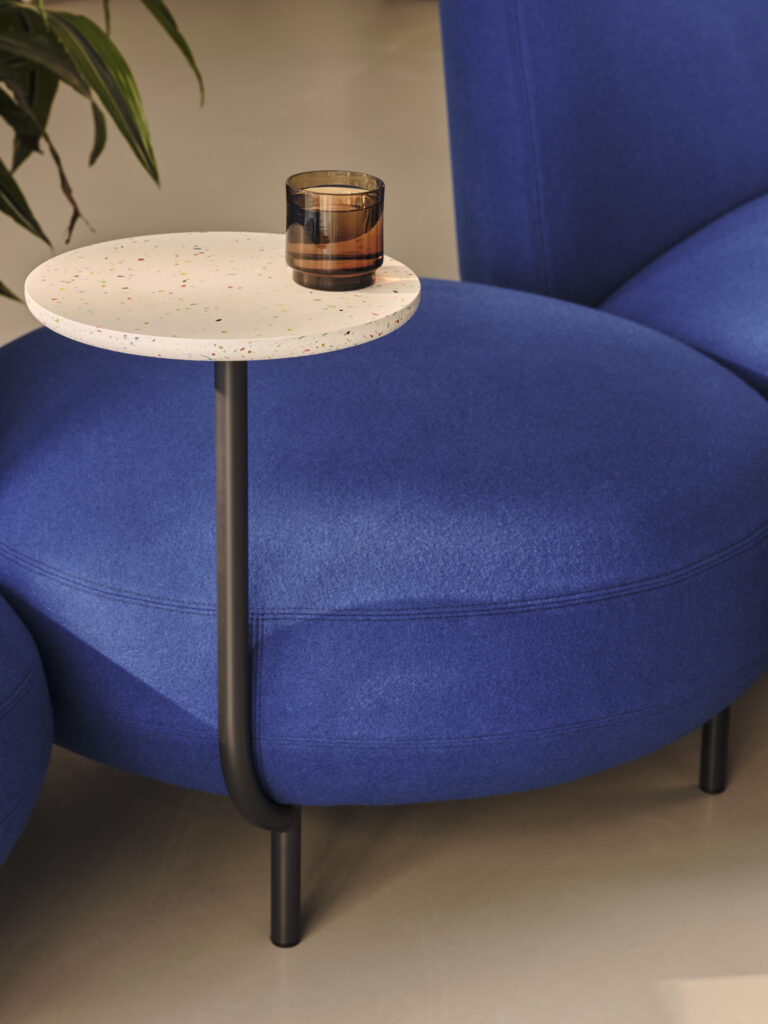 Detail of blue ottoman and table