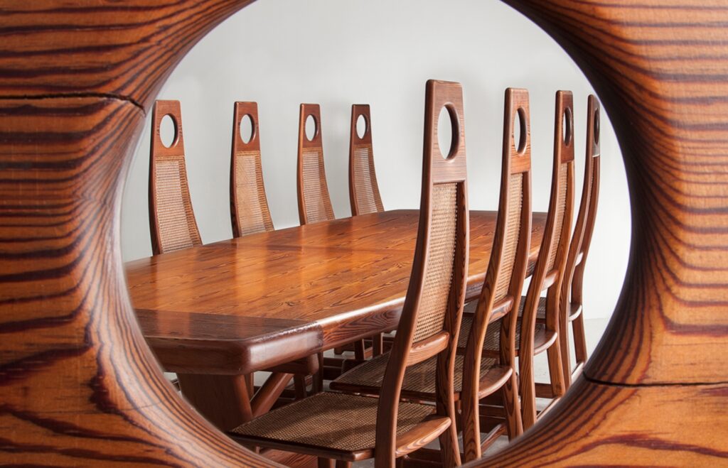 View of table as seen through the circular cutout in the chairs