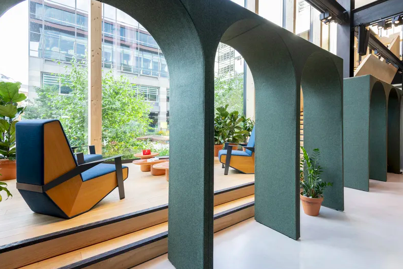 Aeonica in dark green arches in an office environment