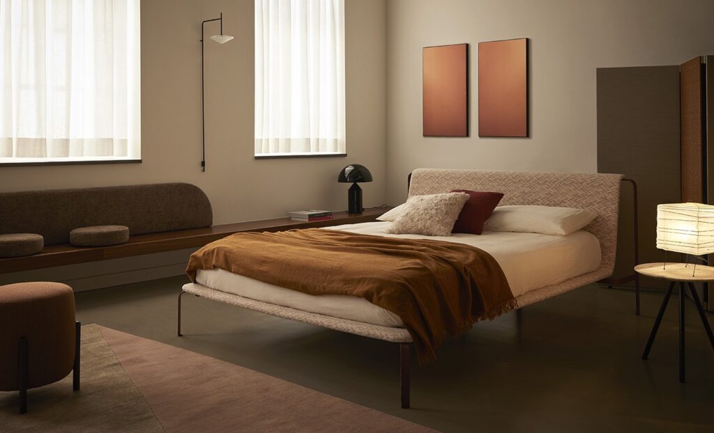 Bolzan Bend-E bed in spare room with contemporary table lamp