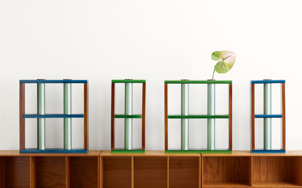 Camino anodzied aluminum and ceramic vessels in red, green, and iridescent silver