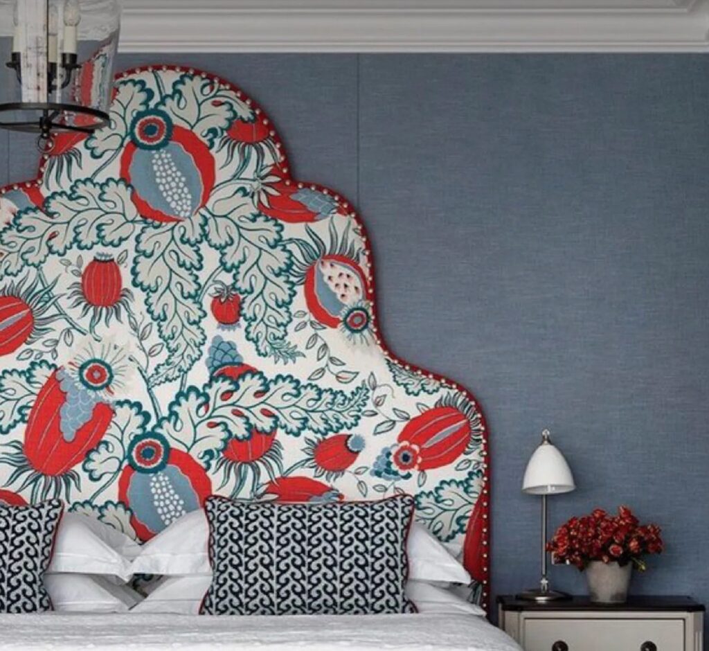 Headboard close-in view with floral design in red, light blue, white