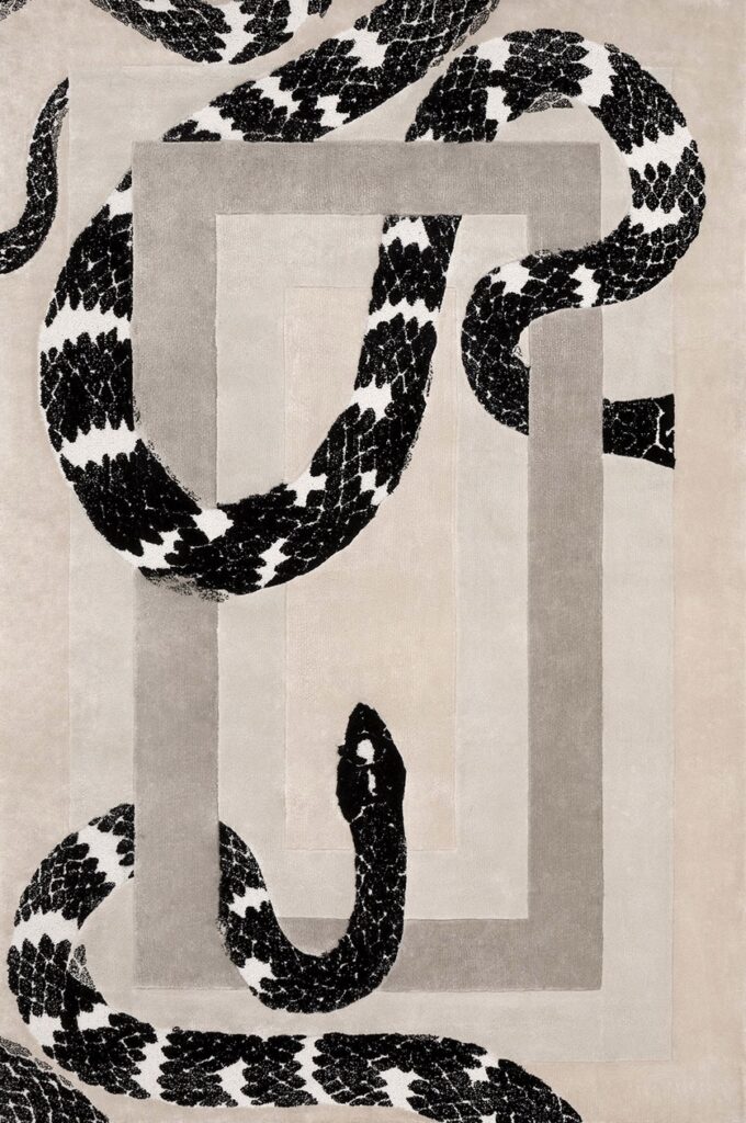 Snake rug with black and white snake wrapped around geometric design