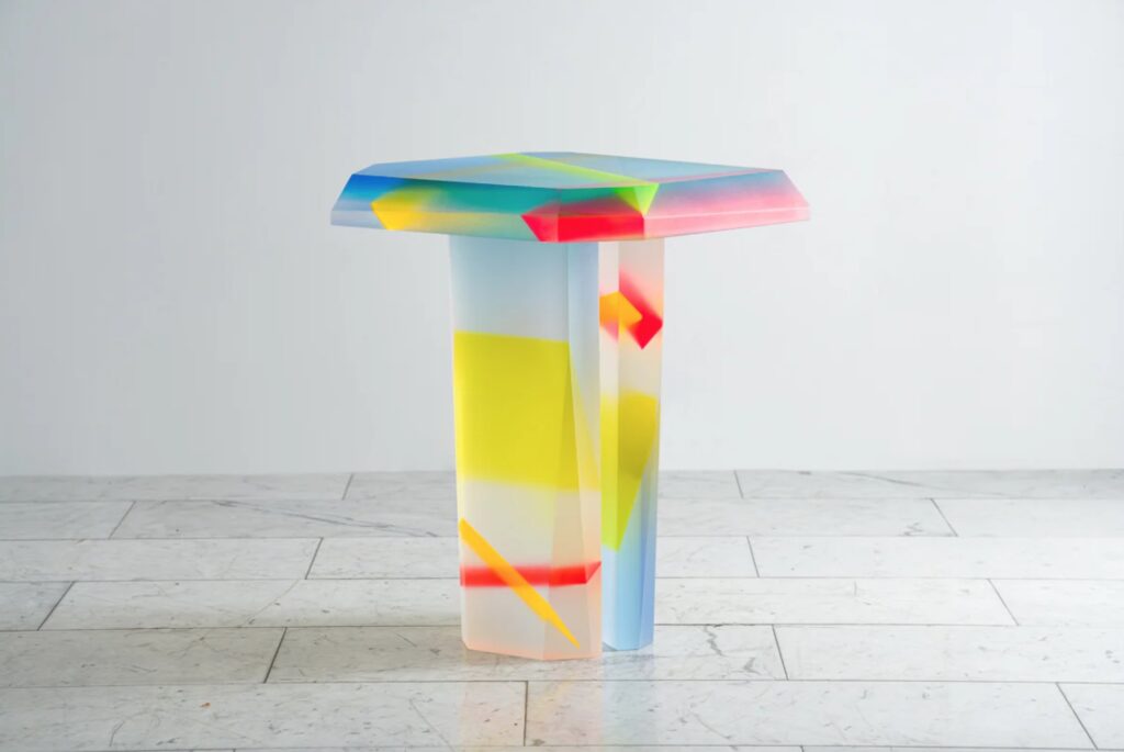 Flare Table made of Lucite with shots of red, yellow, green blue