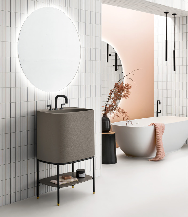 Allegro vanity unit iin tawny color with white tile walls and circular mirror