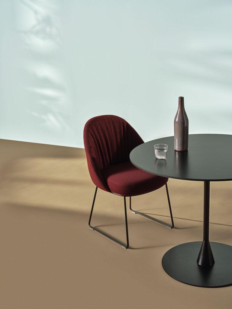 Anla dining chair at table with flask of water