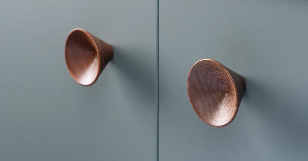 Conical in wood on cabinet