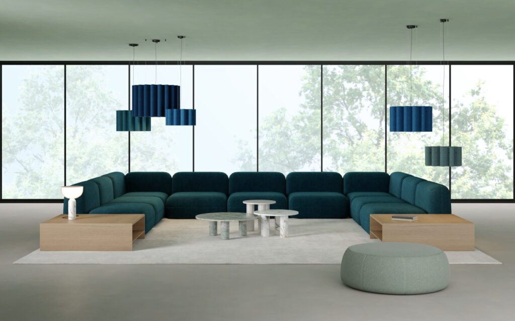 Kurtain room scene with green/blue fixtures and matchiing modular seating arranged as long couch