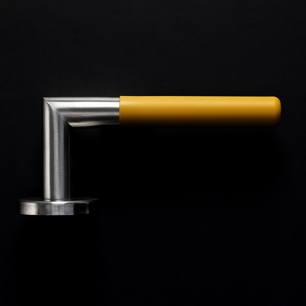 A TOCCO door handle in yellow. 
