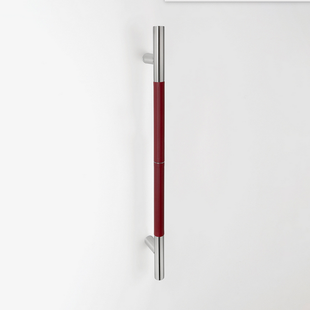 A dark red TOCCO door pull. 