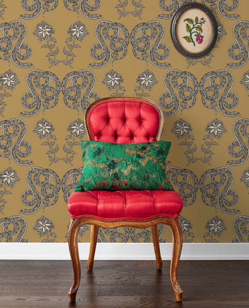 Serpentine design with brown background and plush chair in red velvet