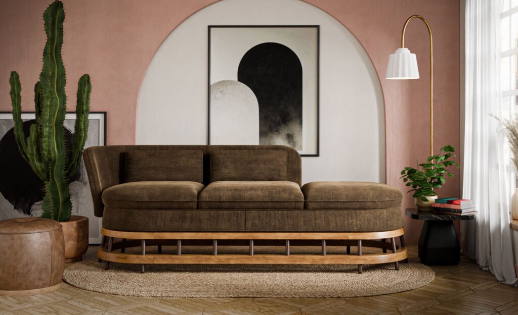 Brown sofa with no back on third cushion in room with mauve walls and a cactus