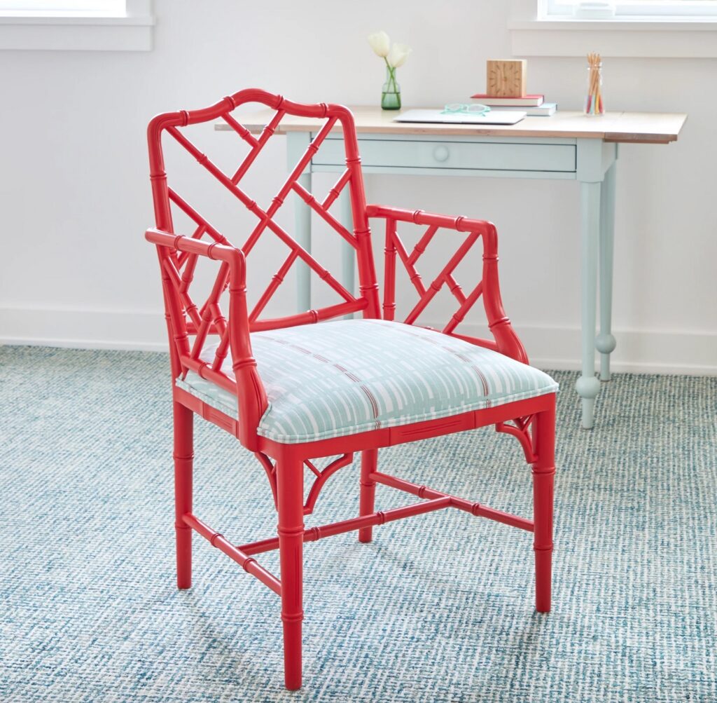 Barrett armchair painted red with blue decorative cushion