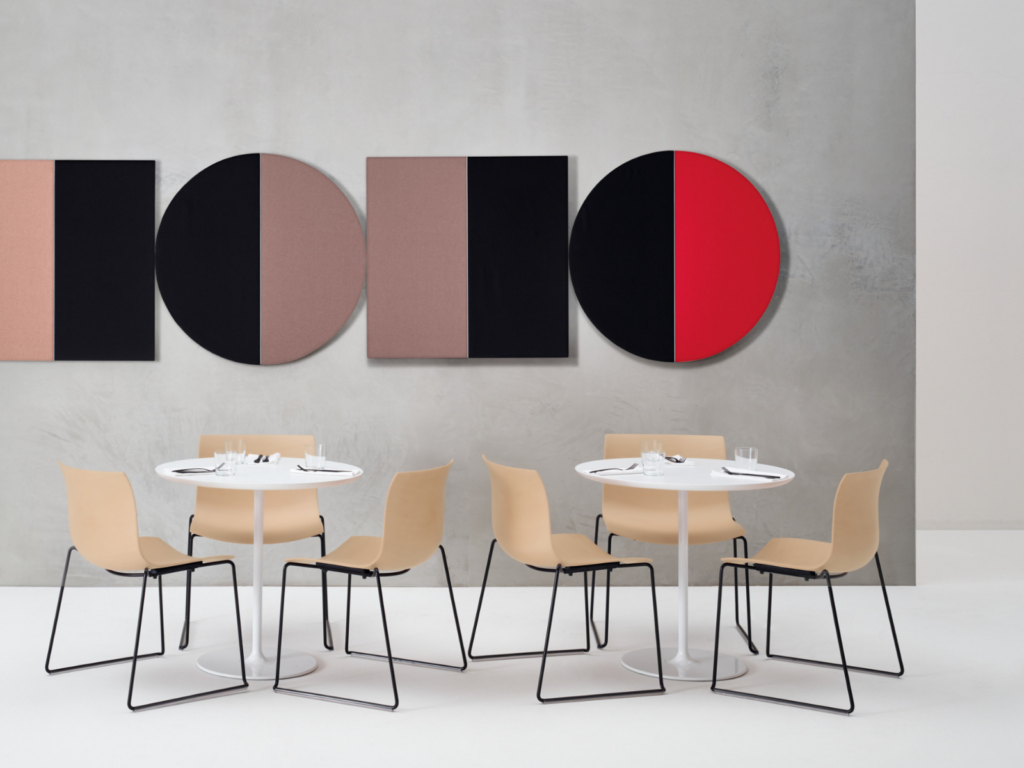 On the wall in contrasting colors with two square panels and cafe tables