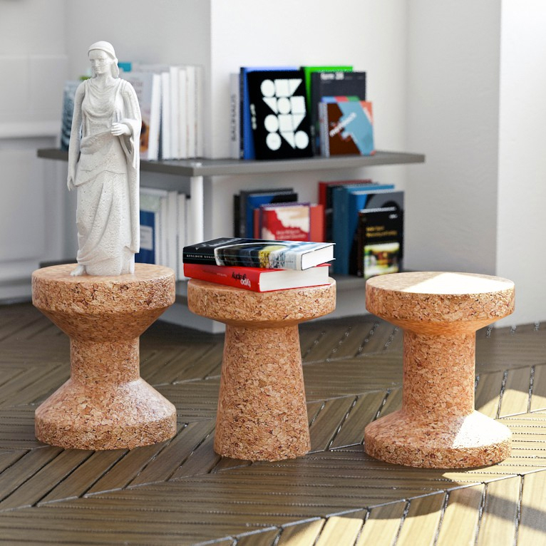 Three cork stools with books and figurine