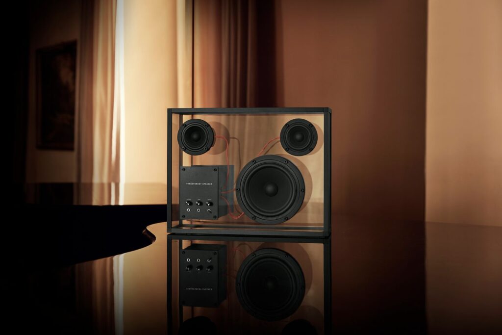 Transparent speaker on glossy surface